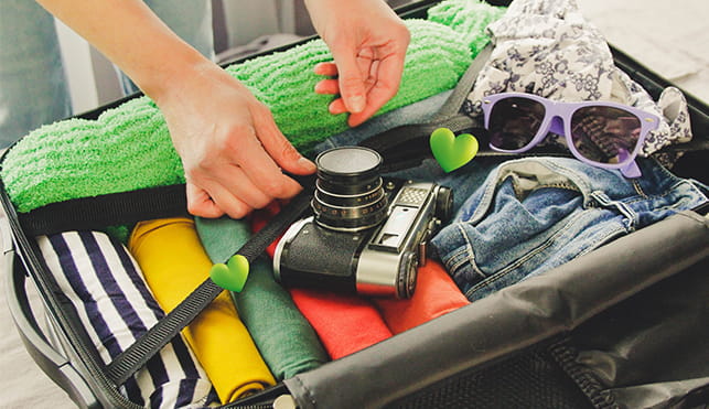 Person packing suitcase